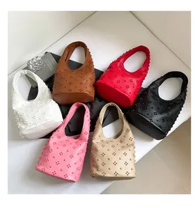 Collection of retro studded bucket bags in six colors with decorative floral bead patterns