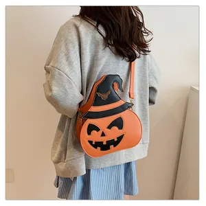 Detail of pumpkin crossbody bag with witch hat and bat element for Halloween costume