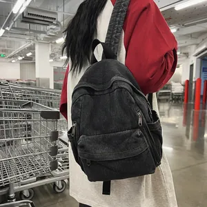Sac à dos en toile denim noir délavé rétro pour étudiants avec poches pratiques