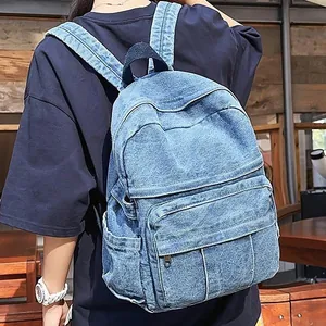 Mochila minimalista de mezclilla azul marino para mujer con bolsillo frontal y compartimentos