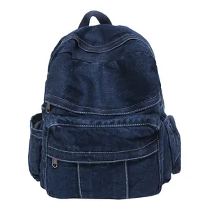 Mochila de mezclilla azul oscuro de estilo japonés con costuras blancas y multibolsillos