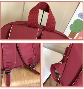 Detail view of burgundy backpack with adjustable straps and top handle stitching
