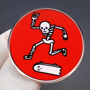 Enamel skull skateboard pin with red background and rose gold metal edge