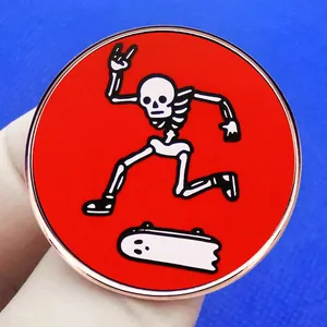 Enamel skull skateboarder pin with red background and rose gold metal edges