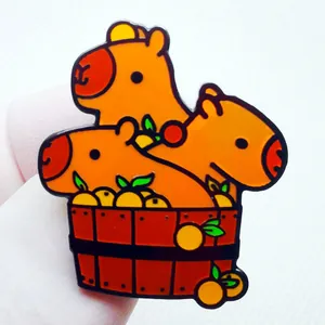 Three cute capybaras bathing in orange tub enamel pin for backpacks and lapels