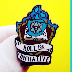 Blue flame shield enamel pin with d20 dice and book for tabletop RPG fans