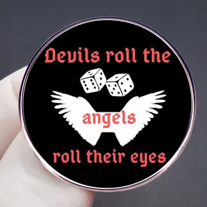 Taylor metal pin with wings and dice design featuring Cruel Summer quote engraving