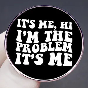 Taylor Swift inspired enamel pin with It's Me Hi I'm The Problem text in black and white