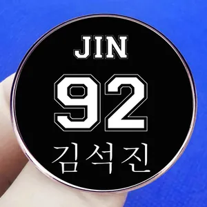 BTS JIN 92 K-pop enamel pin with black circular badge and white artistic lettering