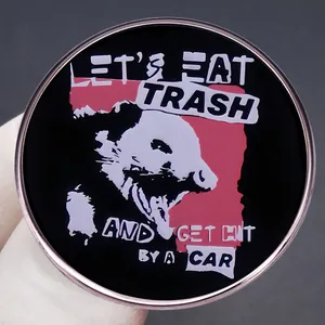 Funny possum enamel pin with 'Let's Eat Trash and Get Hit by a Car' slogan badge