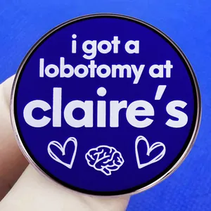 Funny blue round enamel pin with lobotomy joke text and brain graphic for jackets