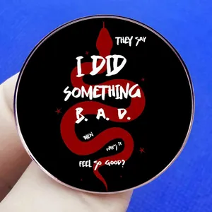 Taylor Swift inspired Reputation snake brooch with lyrics on a black metal round pin