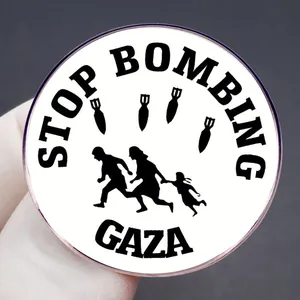 Stop Bombing Gaza round badge pin with anti-war silhouette and black text on white