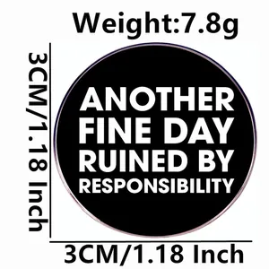 3cm round brooch pin with Another Fine Day Ruined by Responsibility text in black