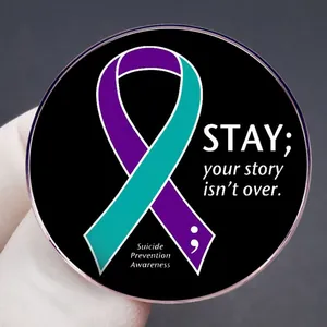 Inspirational mental health awareness pin with teal and purple ribbon and semicolon
