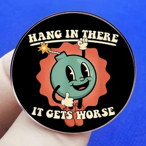 Funny green bomb enamel pin with Hang In There It Gets Worse text for lapel accessories