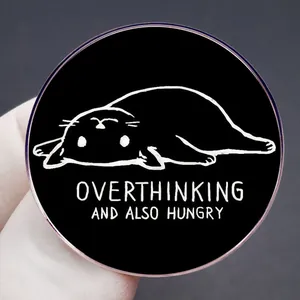 Funny black cat pin badge with Overthinking and also Hungry quote on gray background