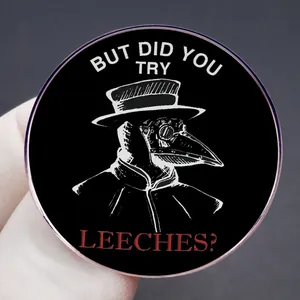 Plague Doctor brooch with But Did You Try Leeches? text on black metal enamel pin