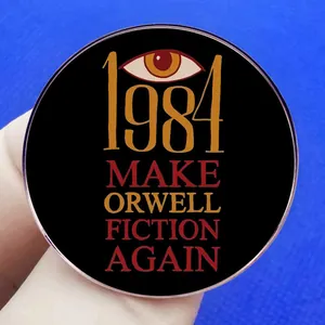 Μεταλλική καρφίτσα βιβλίου George Orwell 1984 με σλόγκαν Make Orwell Fiction Again και μάτι
