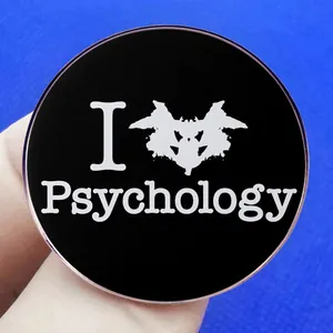 Psychology-themed Rorschach inkblot test pin badge on a minimalist black background