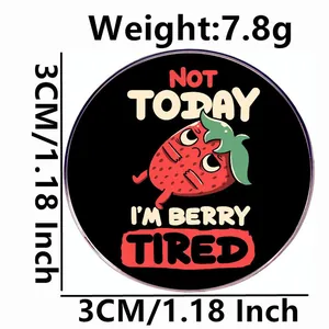 Funny strawberry enamel pin badge featuring Not Today I'm Berry Tired slogan design