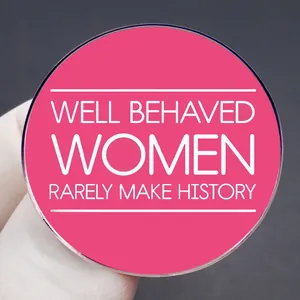 Pink feminist lapel pin with Well Behaved Women Rarely Make History quote badge