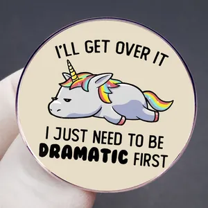 Close-up of a dramatic unicorn acrylic pin badge with funny text on a dark background