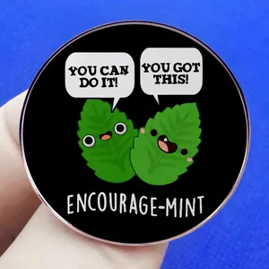 Round cartoon mint badge featuring 'You Can Do It' text on black metal pin