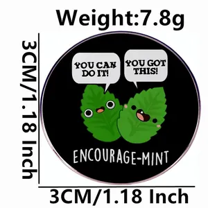 Cartoon mint enamel pin with You Can Do It slogan on black round metal badge