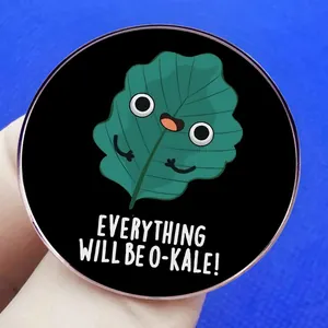 Round mint leaf enamel pin featuring kale cartoon and Everything Will Be O-Kale text