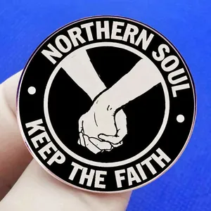 Keep The Faith Northern Soul pin badge featuring a black and white enamel clenched fist design