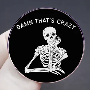 Damn That's Crazy enamel pin featuring a white skeleton leaning on its hand