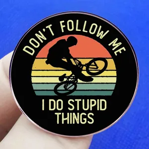 Retro circular BMX rider enamel pin featuring 'Don't Follow Me I Do Stupid Things' text
