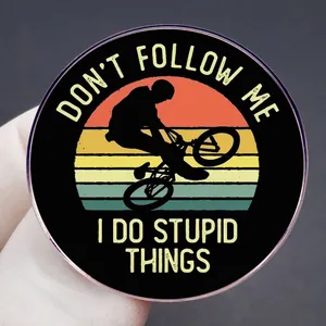 Funny 'Don't Follow Me' cycling slogan round enamel pin with retro gradient and silhouette