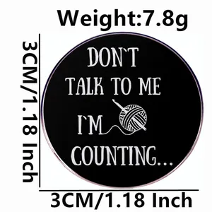 Black 'Don't Talk To Me' knitting enamel pin with yarn pattern, 3cm diameter size view