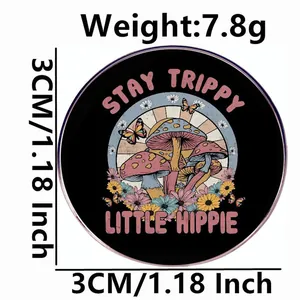 Stay Trippy Little Hippie mushroom pin with colorful flowers on a black background