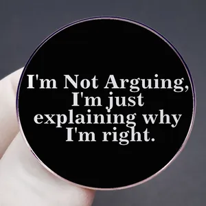 Black round enamel pin badge with white text I'm Not Arguing I'm Just Explaining