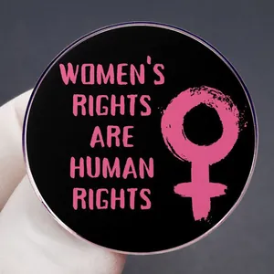 Black and pink circular pin badge with Women's Rights are Human Rights text and symbol