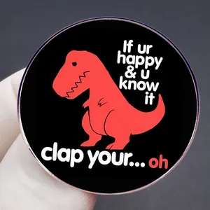 Funny T-Rex enamel pin featuring 'If you're happy and you know it clap your hands' slogan