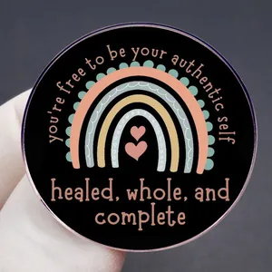 Inspirational rainbow brooch with 'Be Your Authentic Self' quote on black enamel