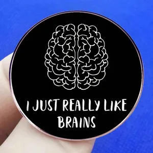 Black round brain brooch with white anatomy art and I Just Really Like Brains slogan