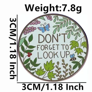 Inspirational enamel pin with 'DON'T FORGET TO LOOK UP' text and nature butterfly motifs