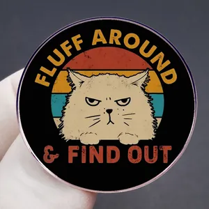 Humorous cartoon cat enamel pin with retro sunset background and Fluff Around text