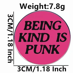 Pink metal badge with Being Kind Is Punk slogan, 3cm diameter and 7.8g weight