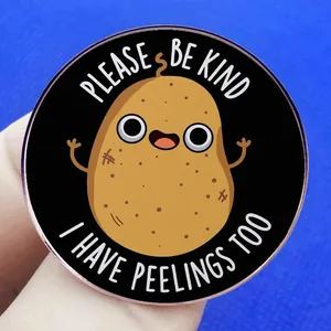 Funny cartoon potato enamel pin with Please Be Kind I Have Peelings Too pun on blue backdrop