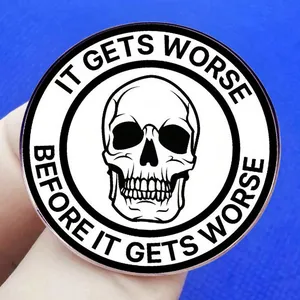 Skull enamel pin with 'It Gets Worse Before It Gets Worse' slogan on blue background