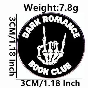 Dark Romance Book Club enamel pin with skeleton rock hand gesture and metal finish