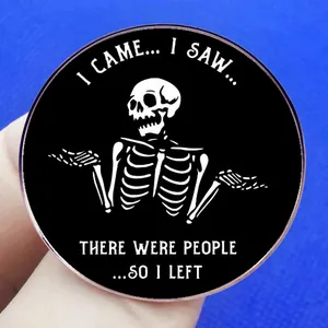 Round black enamel pin with skeleton and I Came I Saw There Were People So I Left text