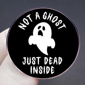 Round black enamel pin with Not a Ghost Just Dead Inside text and ghost illustration