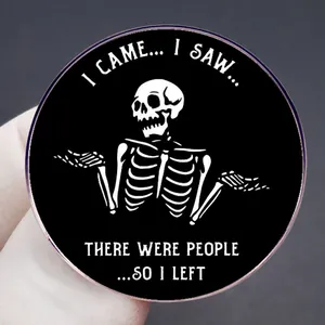 Round black enamel pin with shrugging skeleton and funny social anxiety quote